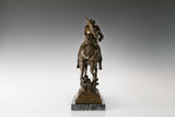 Rear view of bronze equestrian sculpture highlighting the horse mane tail and rider details