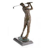 Angled view of a bronze female golfer statue captured in an elegant follow-through swing.