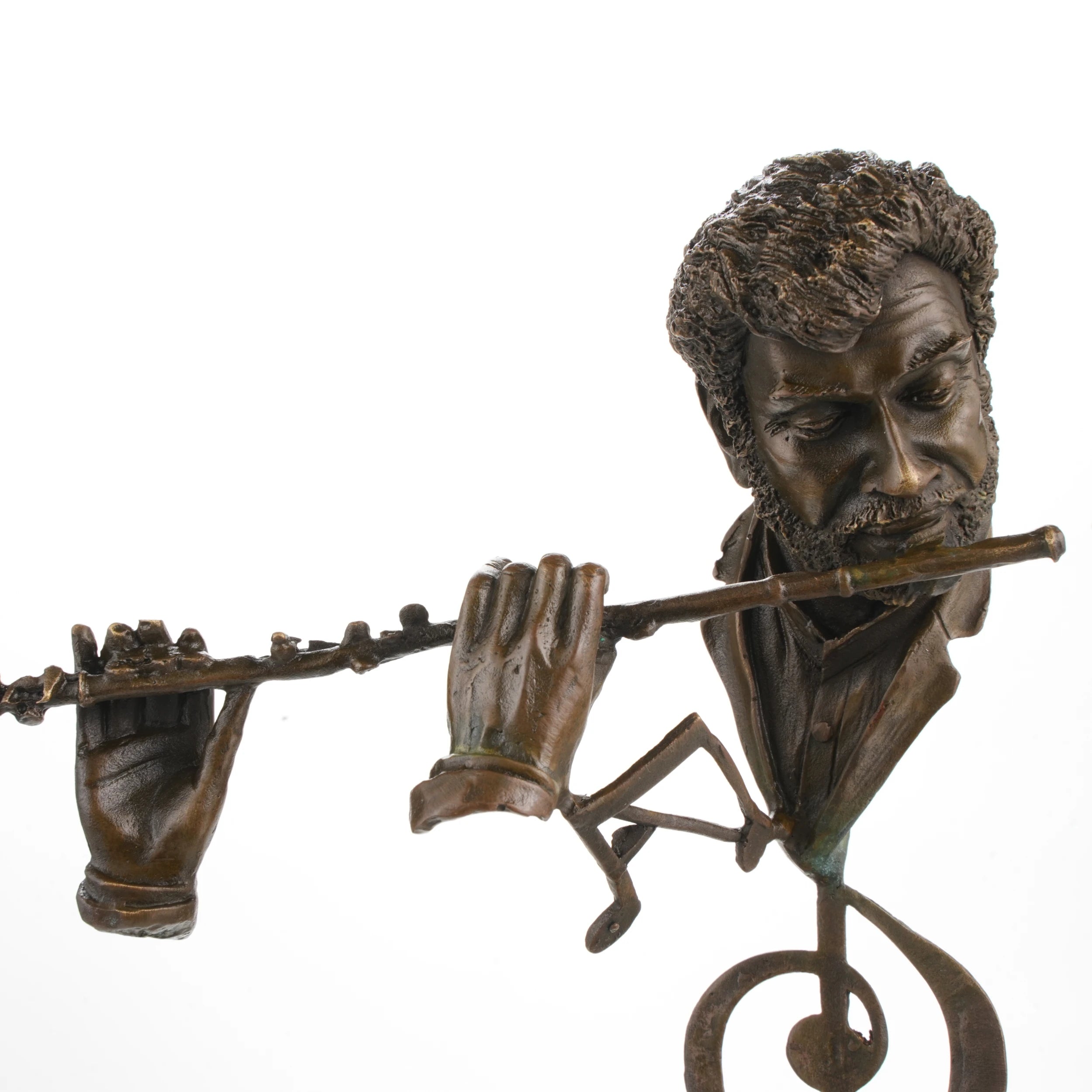 Close-up detail of a handcrafted bronze flutist sculpture showing the flute, hands, and hand-finished bronze patina.