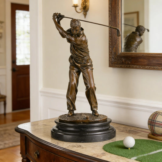 Bronze golfer swing sculpture displayed in an executive office or golf-themed interior.