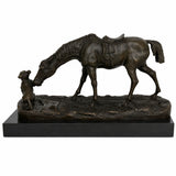 Left side view of bronze horse and dog sculpture with detailed saddle, mane, and textured ground