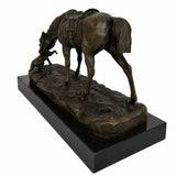 Close-up of handcrafted bronze horse sculpture showing detailed saddle and riding tack