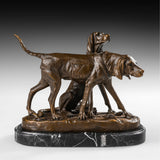 Handcrafted bronze hunting dog pair sculpture with one standing dog and one seated sporting dog