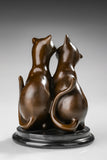rearview of handcrafted bronze kissing cats statue with warm hand-applied patina
