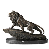Handcrafted bronze lion on rock sculpture in a powerful striding pose with raised head and detailed mane