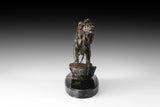 Close-up of bronze lion sculpture showing expressive face and detailed flowing mane