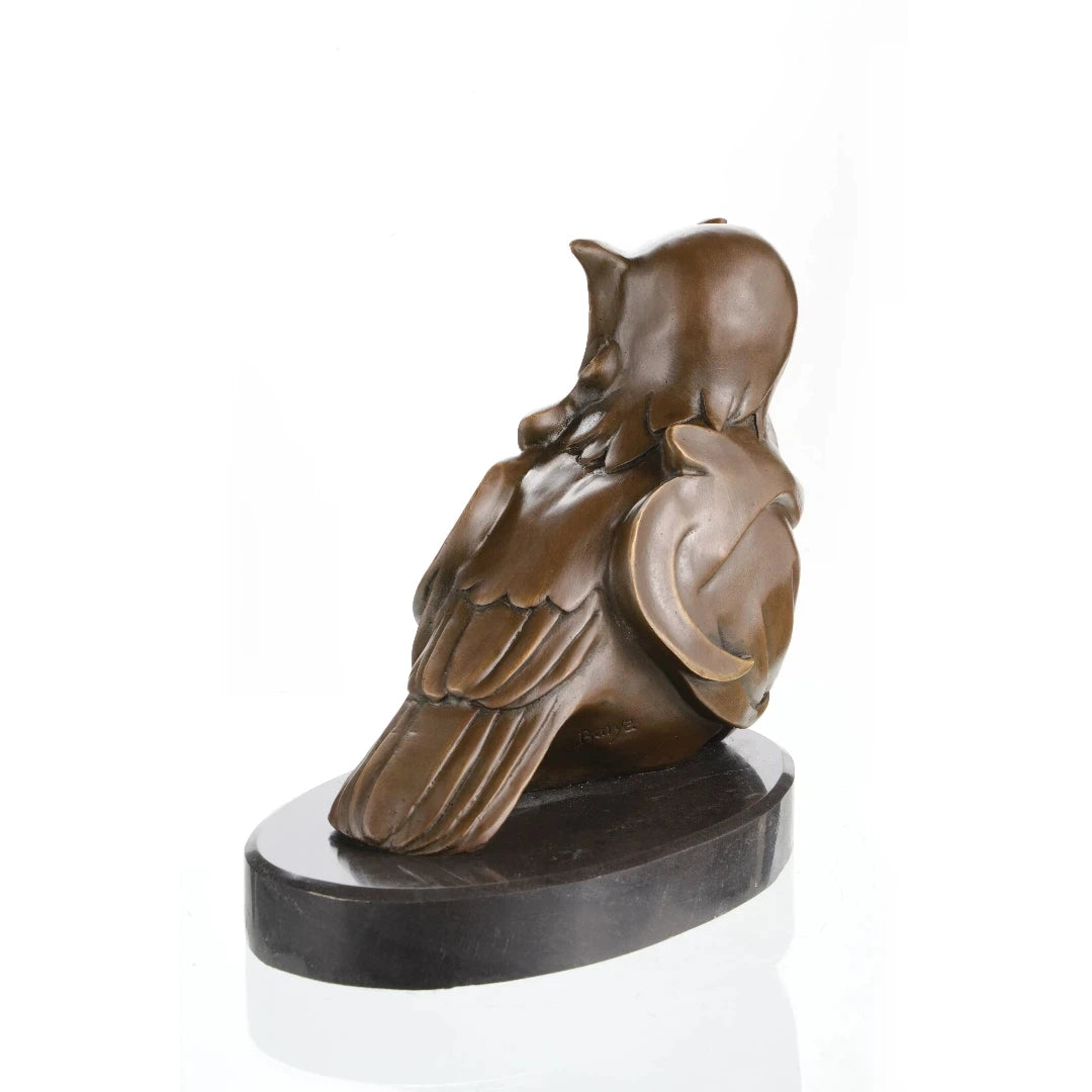 Rear view of bronze mother owl sculpture showing layered wings and sculptural form