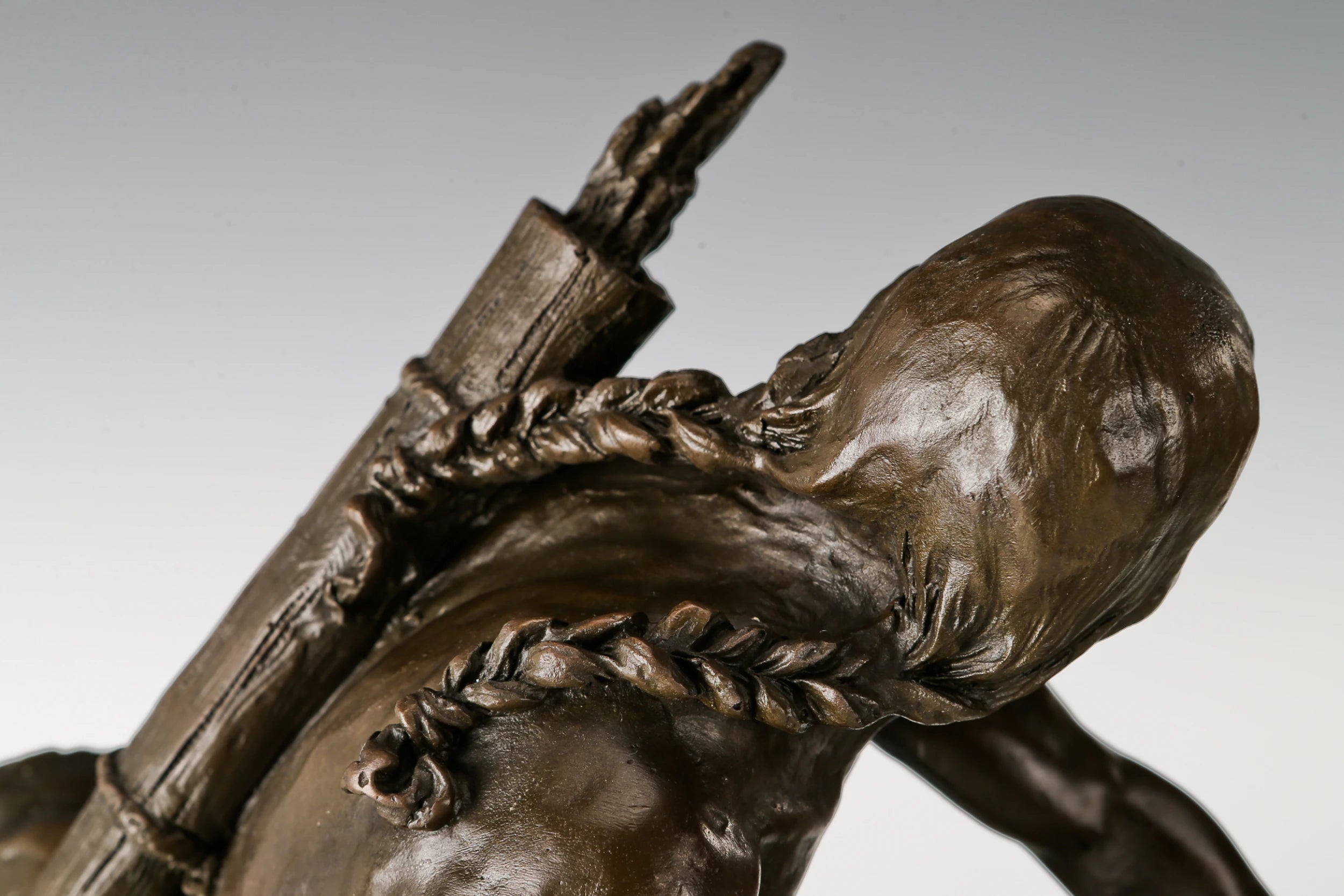 Close-up of the Native American rider showing expressive pose and handcrafted bronze detail