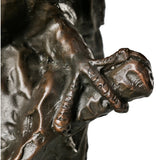 Detailed view of textured branch beneath the mother and baby owl sculpture
