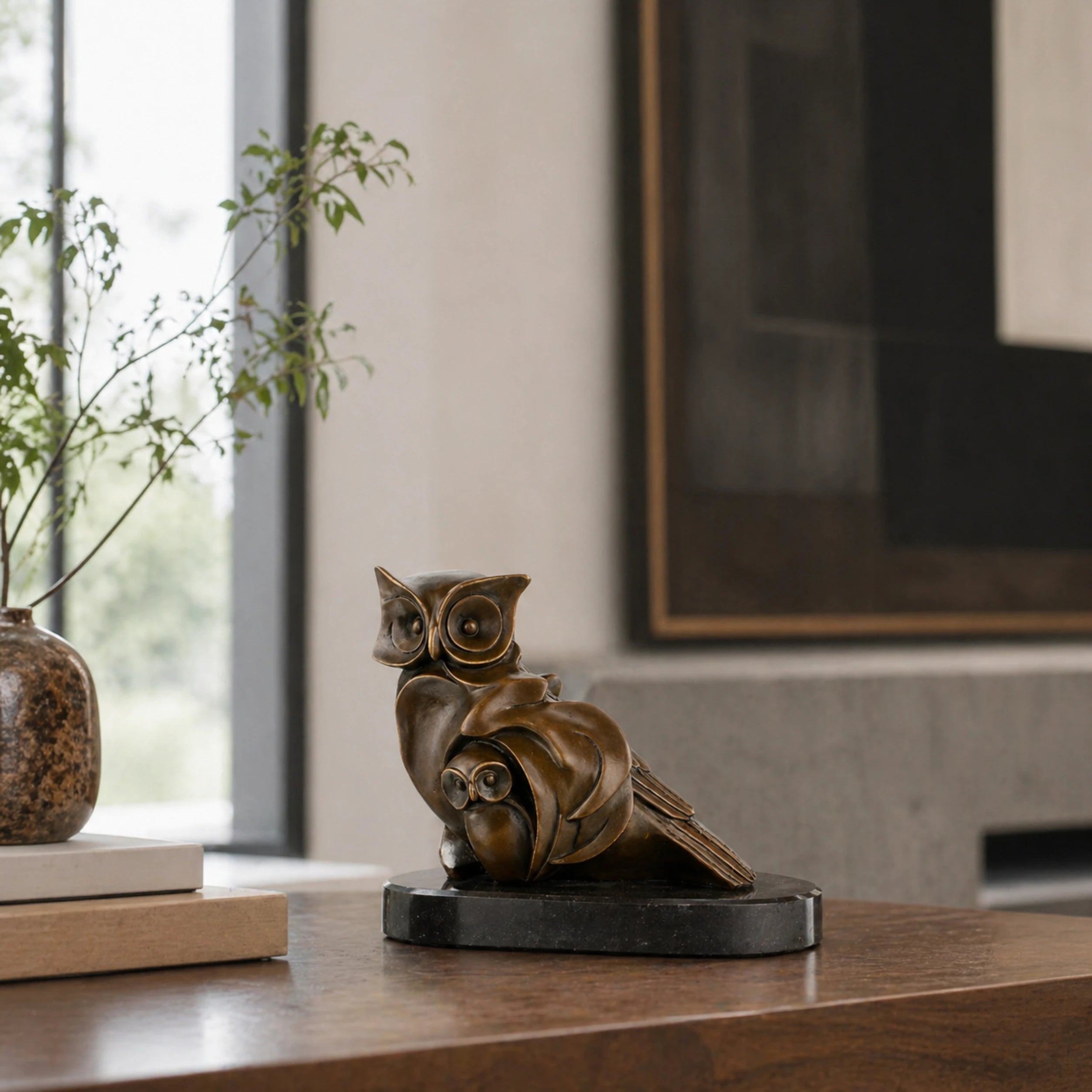 Bronze mother and baby owl sculpture displayed as elegant library and home decor