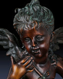 Close-up of the expressive face and curly hair of a handcrafted bronze Putto figure