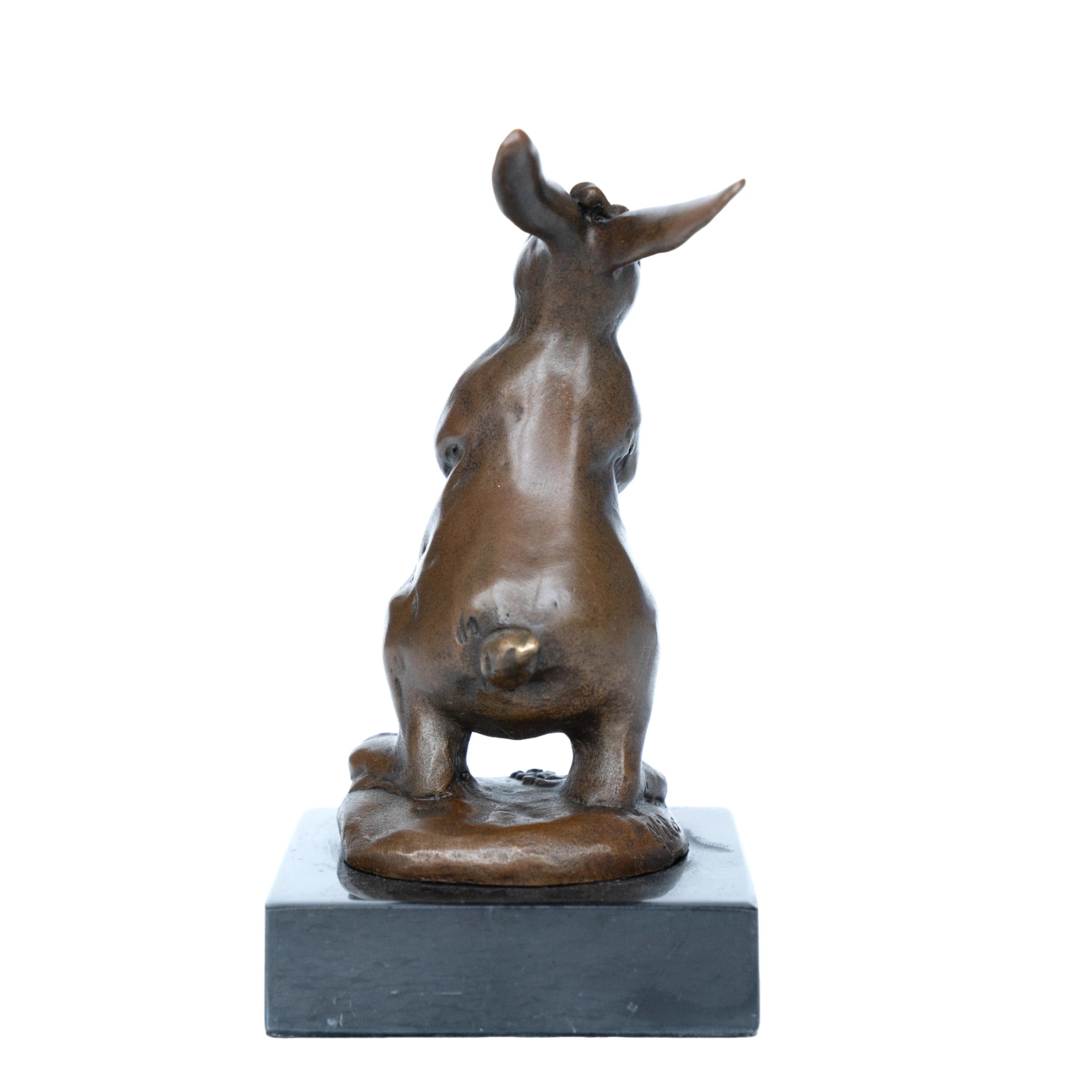 Rearview of bronze rabbit statue holding a basket filled with flowers