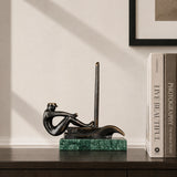 Bronze sailboat sculpture displayed as elegant nautical decor in a modern coastal interior