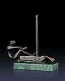 Left side view of bronze sailing sculpture with stylized sailor and contemporary boat design