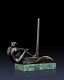 Left side view of bronze sailing sculpture with stylized sailor and contemporary boat design