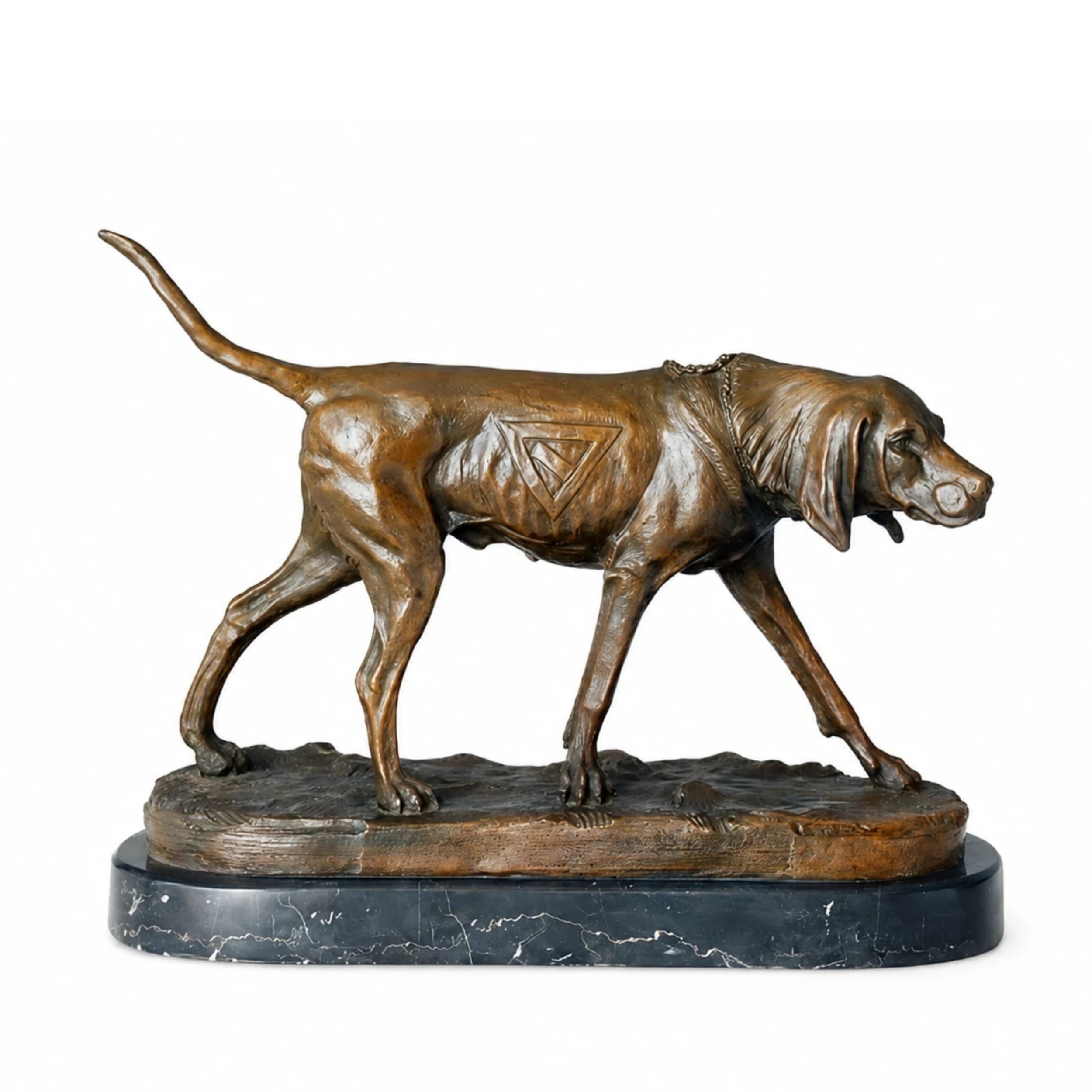 Handcrafted bronze hunting dog sculpture standing in an alert tracking pose