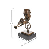 Close-up detail of a handcrafted bronze trumpet player sculpture showing the trumpet, expressive portrait, and hand-finished bronze patina.