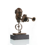Front view of a handcrafted bronze trumpet player sculpture on a natural marble base.