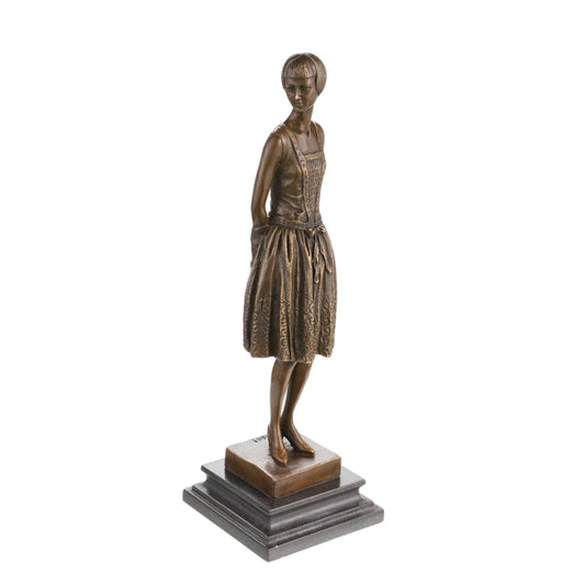 Left side view of bronze female figure sculpture with slender silhouette and vintage styling