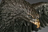 Majestic bald eagle bronze sculpture with wings spread and talons extended. A powerful wildlife statue symbolizing freedom, strength, and leadership.