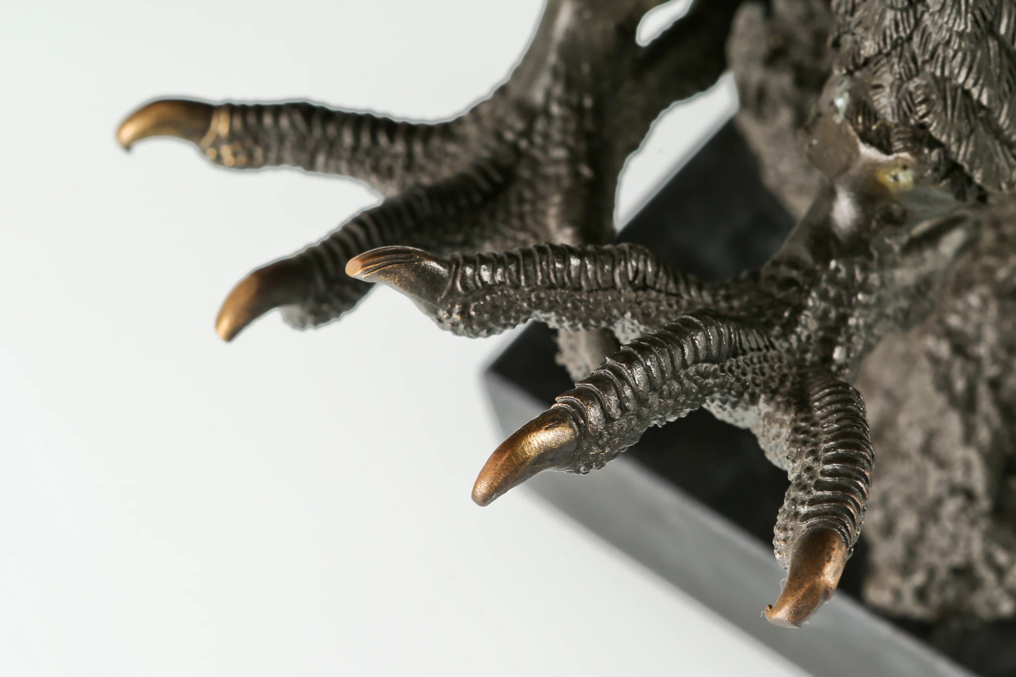 Majestic bald eagle bronze sculpture with wings spread and talons extended. A powerful wildlife statue symbolizing freedom, strength, and leadership.