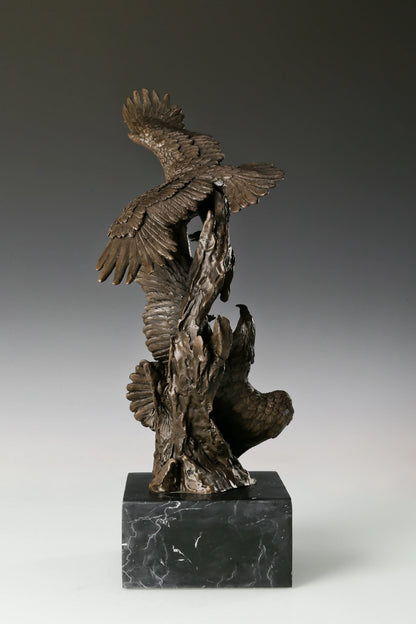 Own this powerful Solid Bronze Eagle Statue featuring two eagles in dynamic interaction. Set on a Black Marble Base, this Wildlife Bronze Art is a perfect Power Symbol for Executive Office Decor. Hand-cast quality.