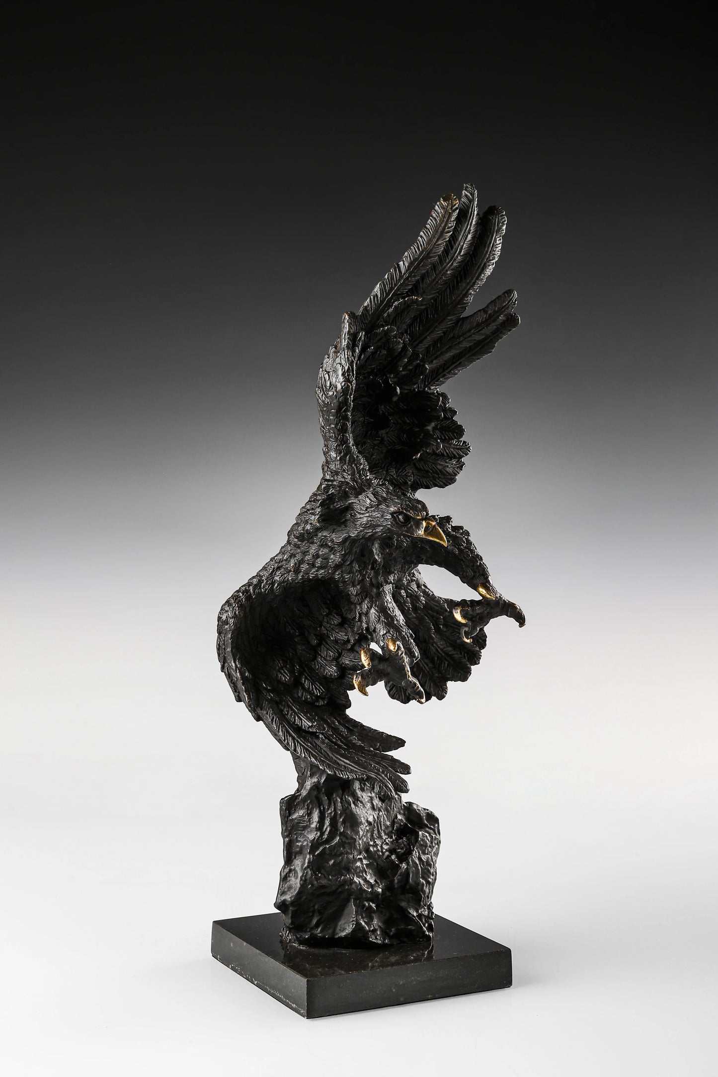Dynamic bald eagle bronze sculpture in a powerful diving pose with marble base. A striking wildlife statue symbolizing strength, freedom, and leadership.
