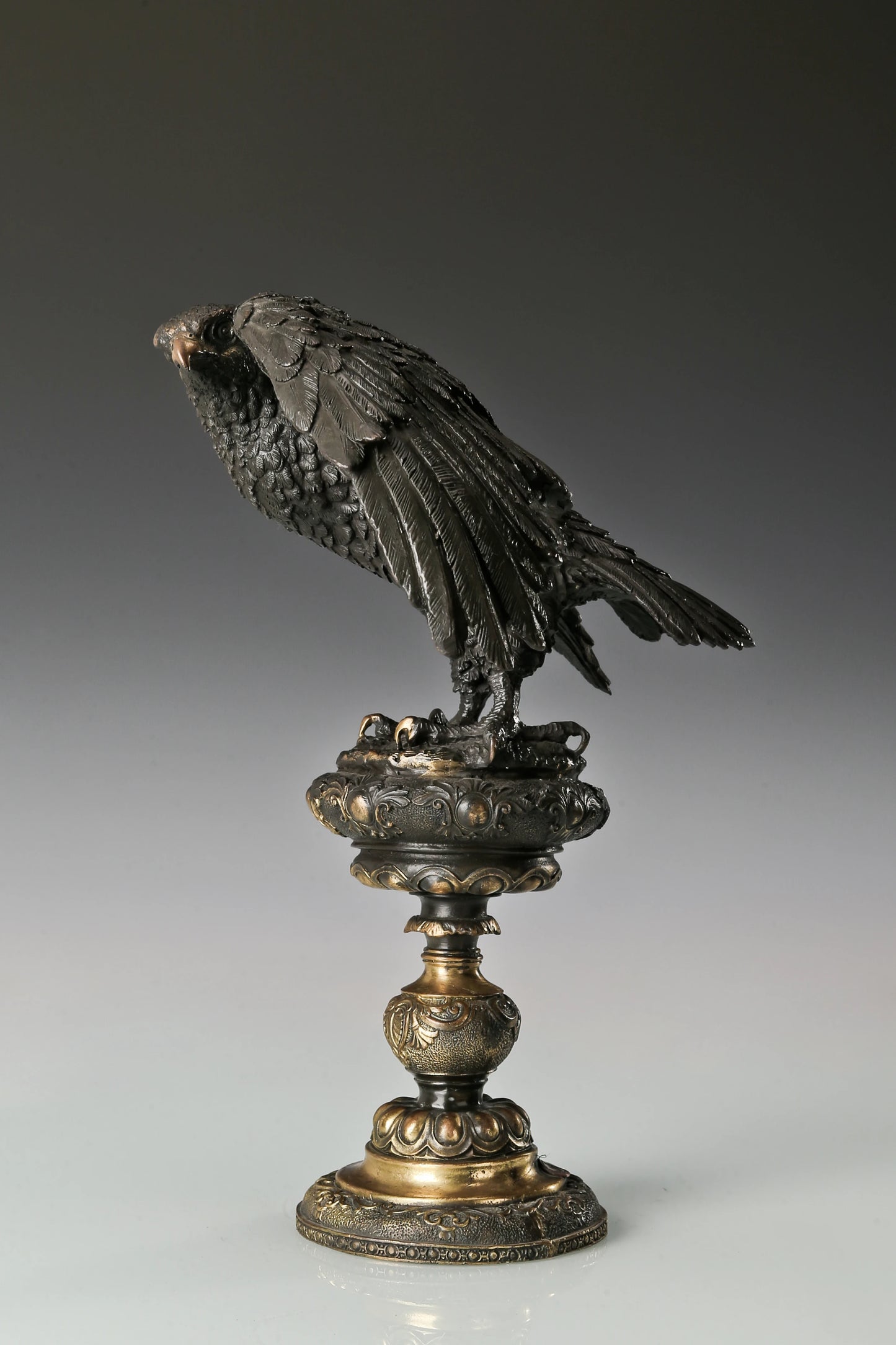 bronze eagle statue with ornate base