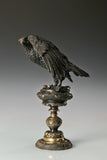 bronze eagle statue with ornate base