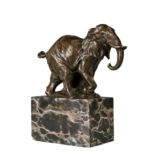 Dynamic bronze elephant sculpture featuring expressive texture and raised trunk. A striking wildlife statue symbolizing strength, resilience, and prosperity.