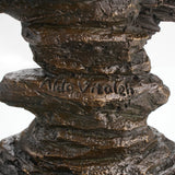 Bronze figurine mounted on round black marble plinth