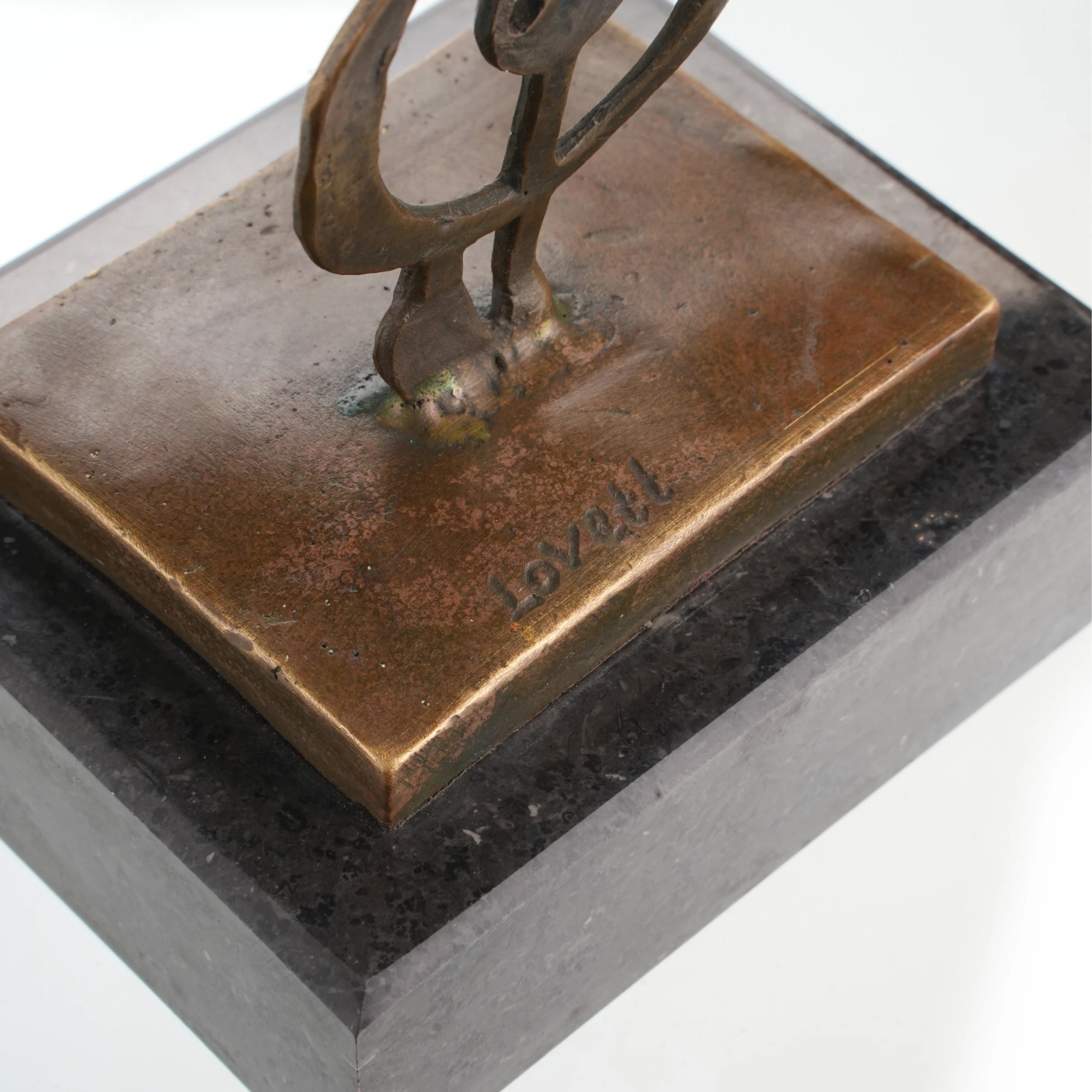 Bronze music sculpture mounted on square marble base