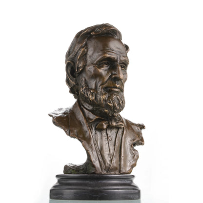 Detailed bronze bust of Abraham Lincoln, 16th President of the United States. Handcrafted using the lost-wax method, this sculpture captures Lincoln’s wisdom, dignity, and iconic features, mounted on a marble base.