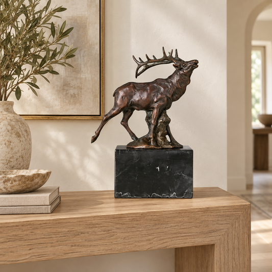 Bugling elk bronze sculpture displayed in an elegant lodge-style interior