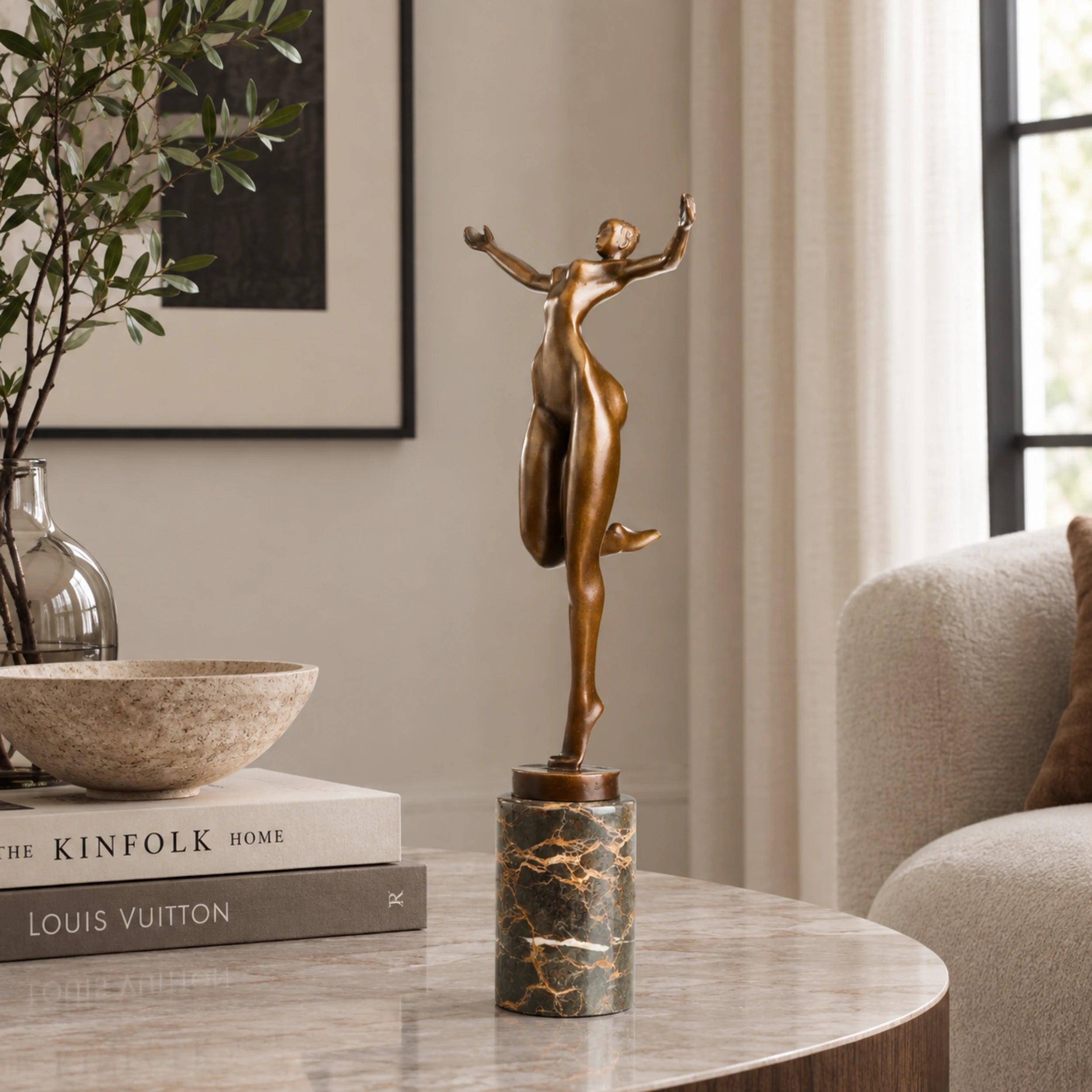 Celebrating Female Dancer Bronze Sculpture displayed in a modern interior