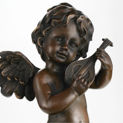 Close-up of cherub face playing mandolin