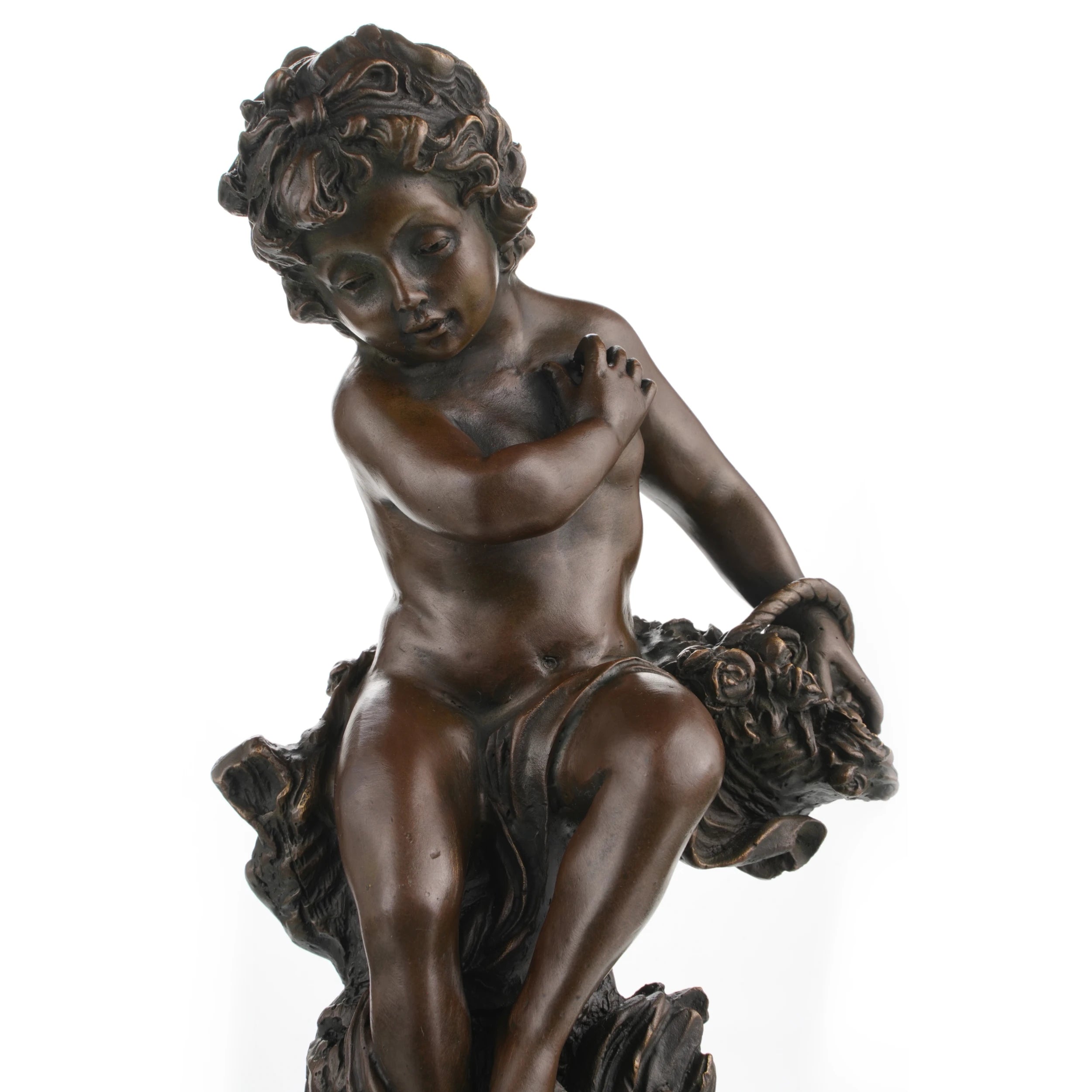 Close-up of sleeping cherub face in bronze