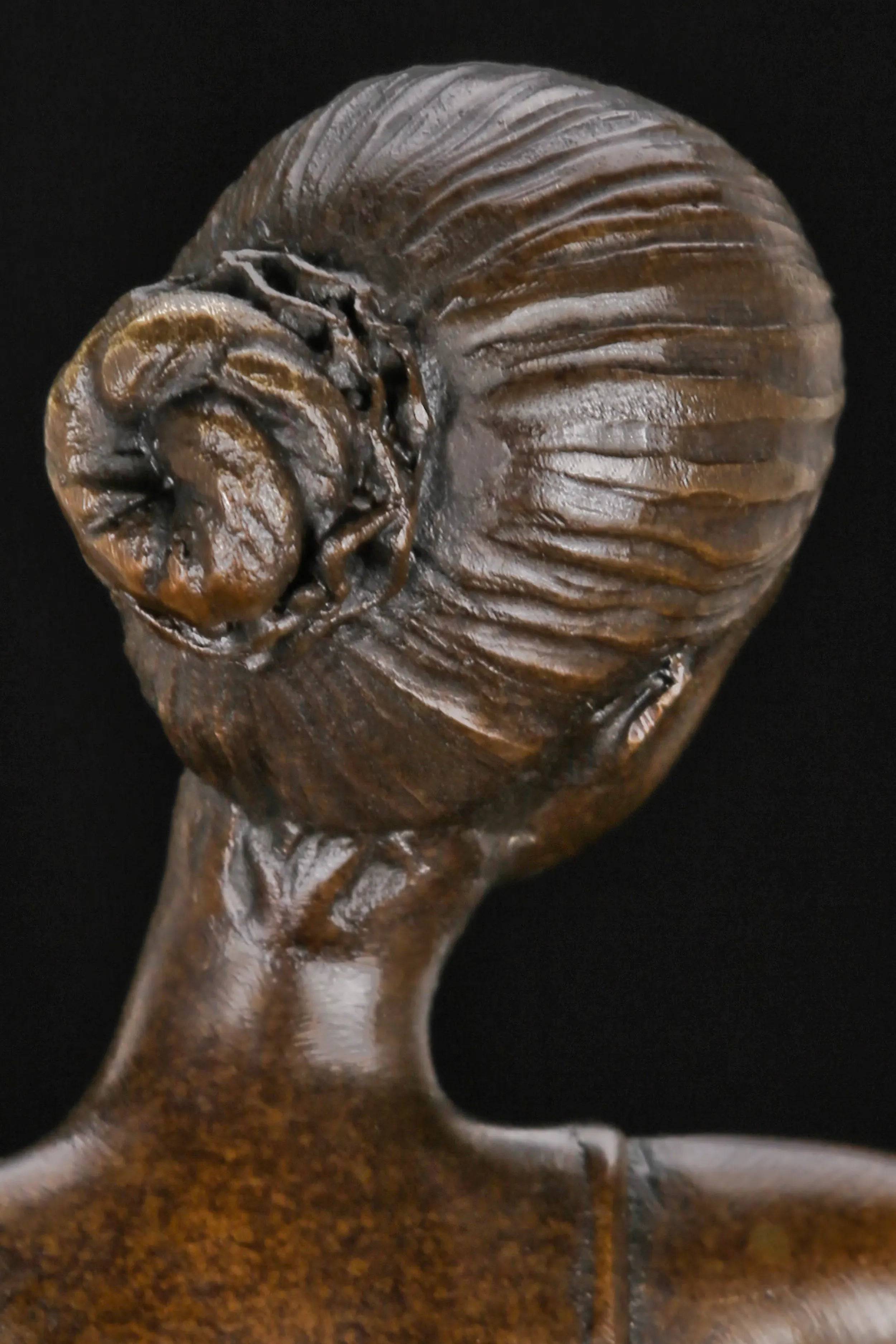 Close-up of the ballerina bronze sculpture showing her hair