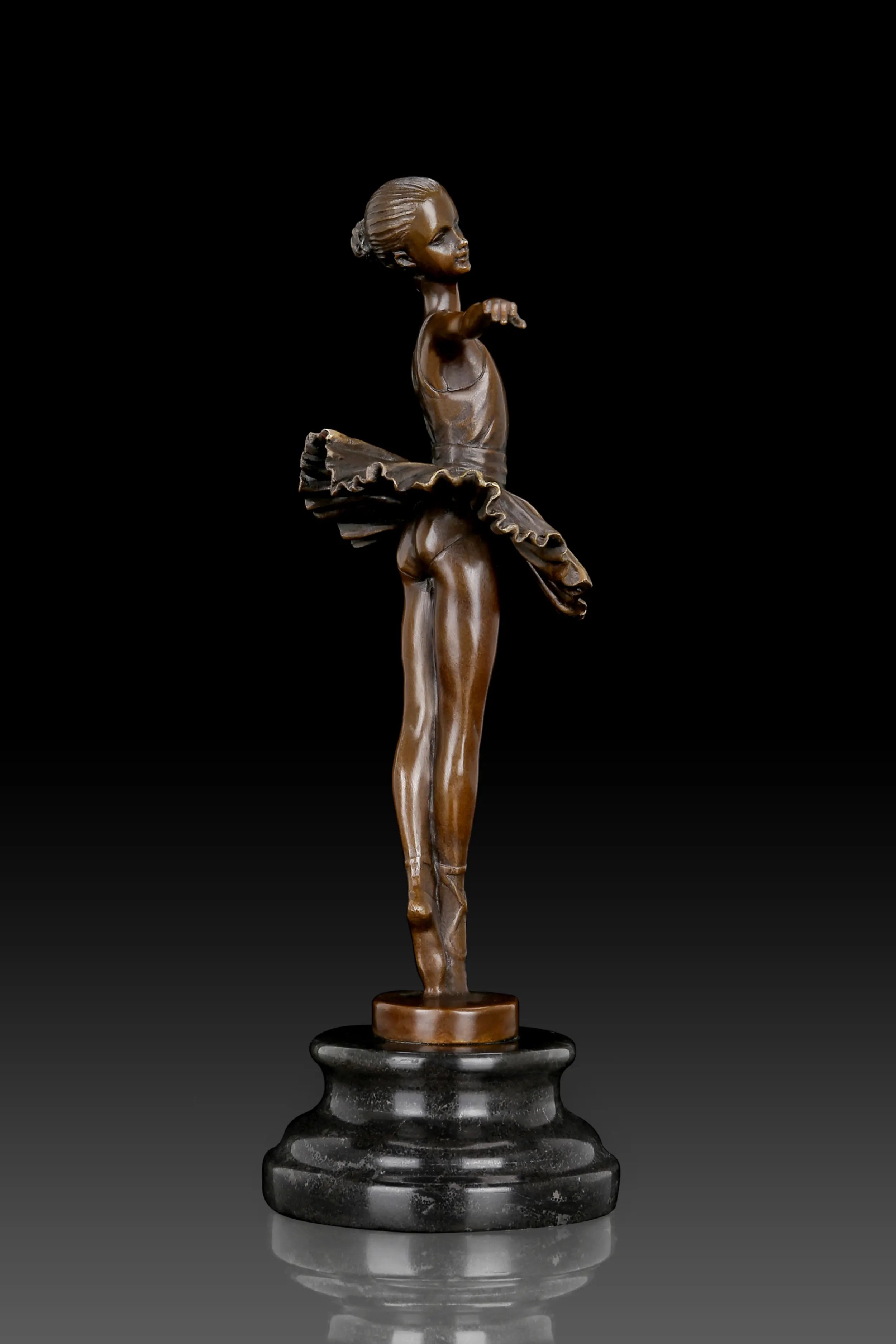 Three-quarter view of classical ballerina bronze sculpture on a black marble base
