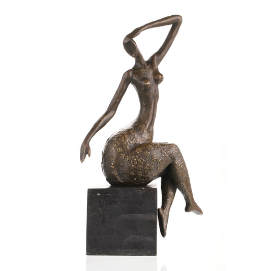 Contemporary abstract bronze seated female sculpture with golden floral motifs, graceful woman statue with raised arm on black marble base, loss wax casting modern art.