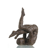 Contemporary abstract bronze sculpture of a contorted gymnastic figure with maze patterns, symbolic labyrinth human form statue, loss wax casting avant-garde art.
