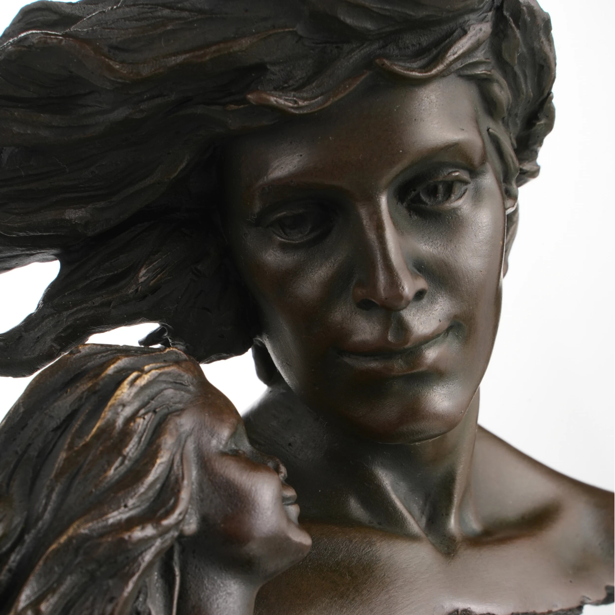 Close-up of couple facial expression in bronze sculpture
