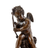 Close-up of Cupid carefully repairing his bow in a handcrafted bronze sculpture
