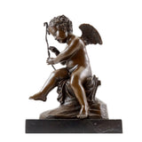 Angled view of Cupid repairing his bow bronze sculpture with classical mythological details