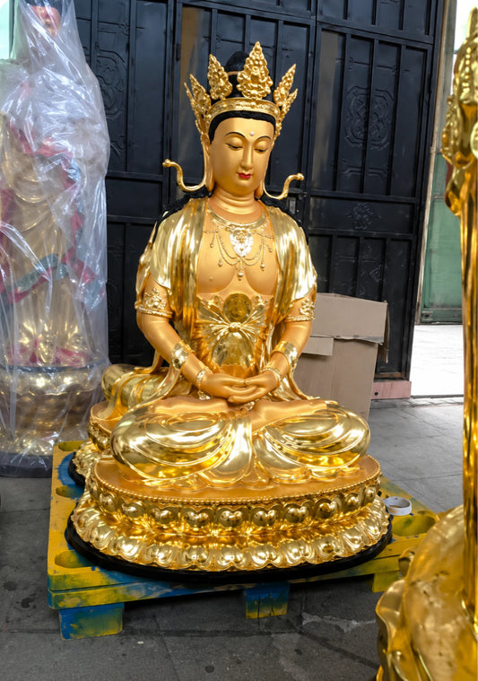 Custom religious bronze statue with gold finish in the workshop