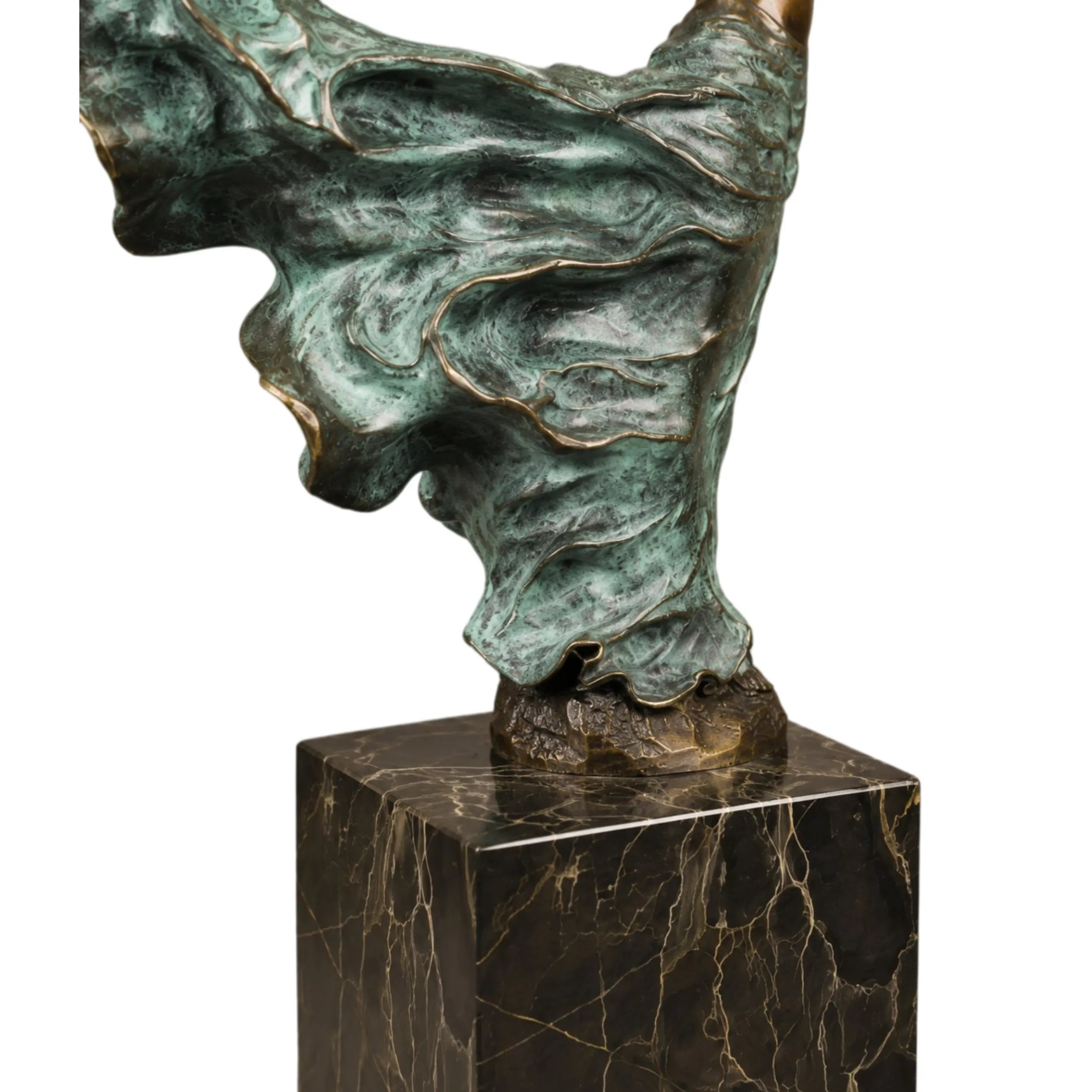 Back view of dancing female bronze sculpture showing flowing dress details