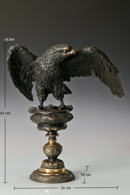 Bronze eagle statue with wings partially spread and decorative base. Classical wildlife sculpture for home decor, office, or collectors.