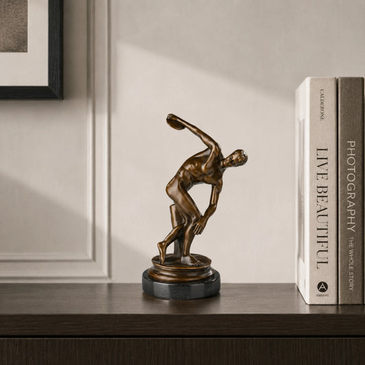 Discus Thrower Bronze Sculpture displayed in a styled interior