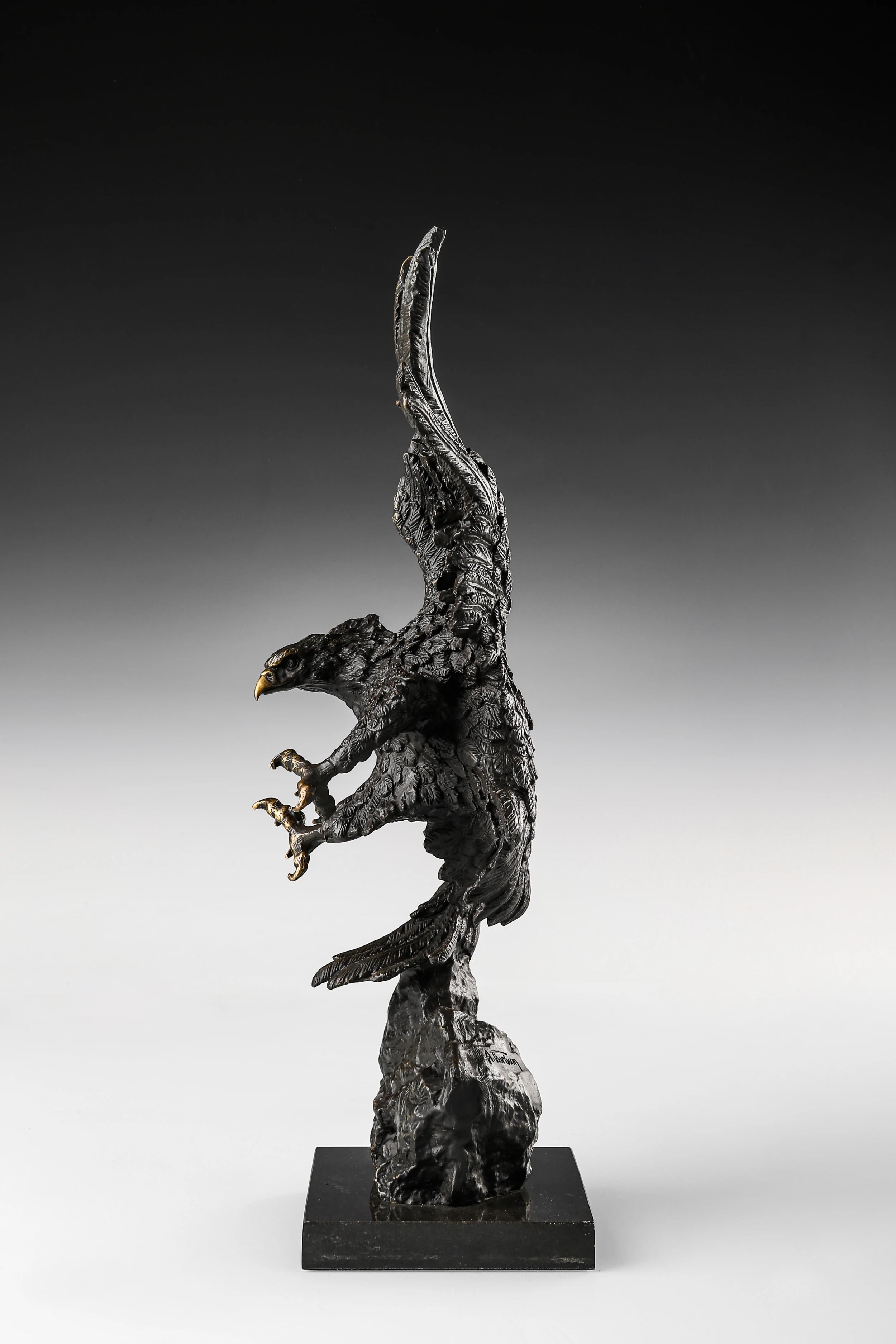 Dynamic bald eagle bronze sculpture in a powerful diving pose with marble base. A striking wildlife statue symbolizing strength, freedom, and leadership.