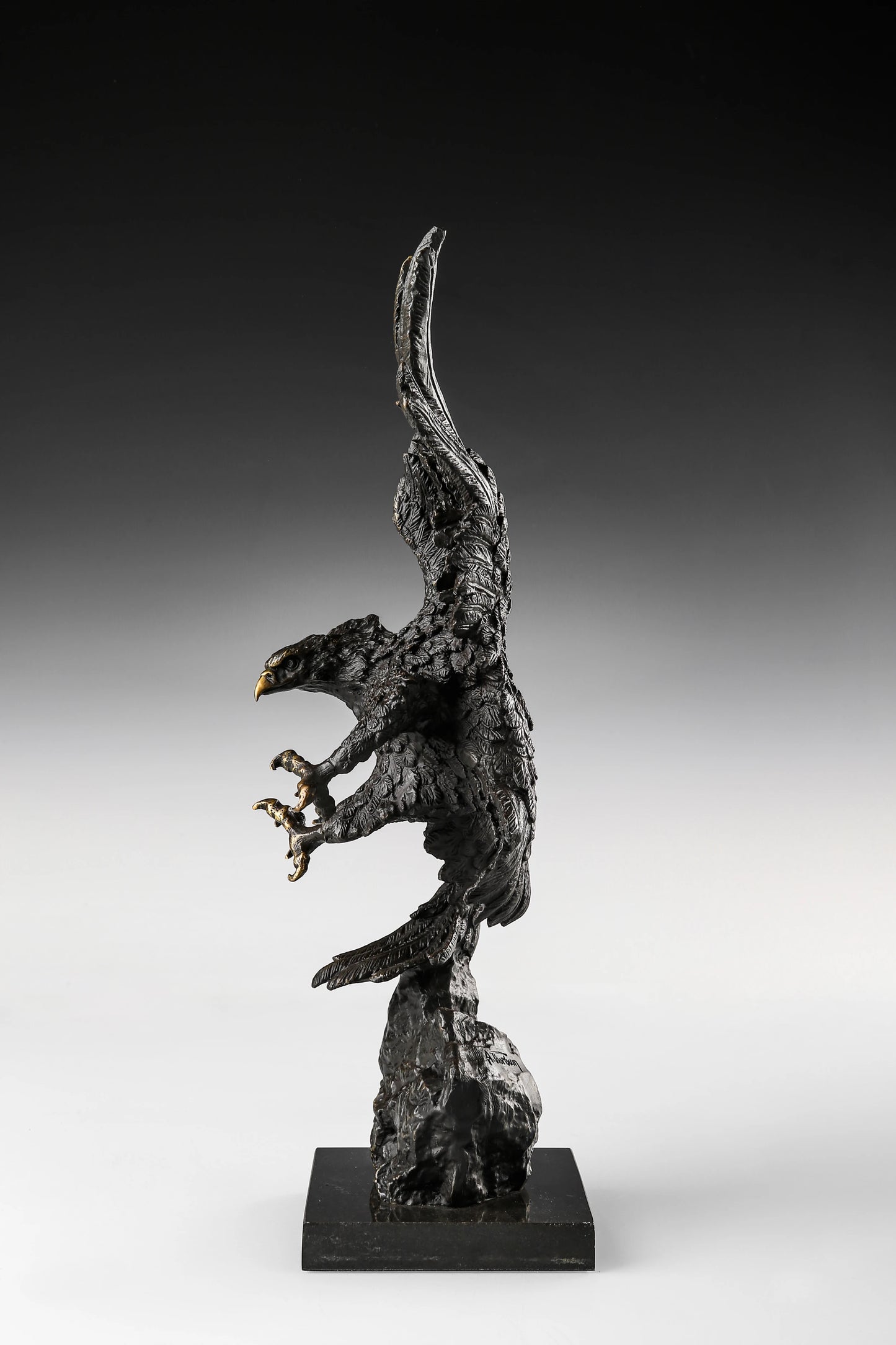 Dynamic bald eagle bronze sculpture in a powerful diving pose with marble base. A striking wildlife statue symbolizing strength, freedom, and leadership.